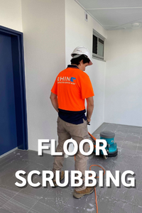 team member doing floor scrubbing