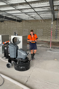 Team member doing concrete grinding