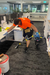 team member doing office cleaning