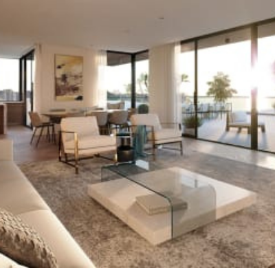 Modern living room with large windows, contemporary furniture, and a view of a balcony.